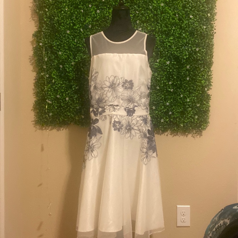 J Taylor . Party dress . White with sparkle blue thread flowers size 14